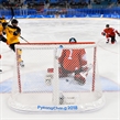 GANGNEUNG, SOUTH KOREA - FEBRUARY 20: Germany's Leonhard Pfoderl #83 gets the puck past Switzerland's Jonas Hiller #1 to score a first period goal with Philippe Furrer #54, Gaetan Haas #92 and Germany's Felix Schutz #55 looking on during qualification playoff round action at the PyeongChang 2018 Olympic Winter Games. (Photo by Matt Zambonin/HHOF-IIHF Images)

